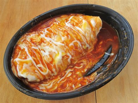 Taco bell smothered burrito - Taco Villa Bean Smothered Burrito (380 grams) contains 60g total carbs, 49g net carbs, 190g fat, 19g protein, and 490 calories.